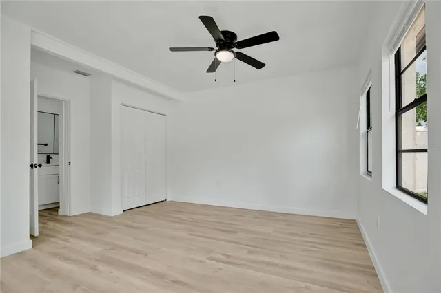 a kitchen with a refrigerator a sink and a stove top oven
