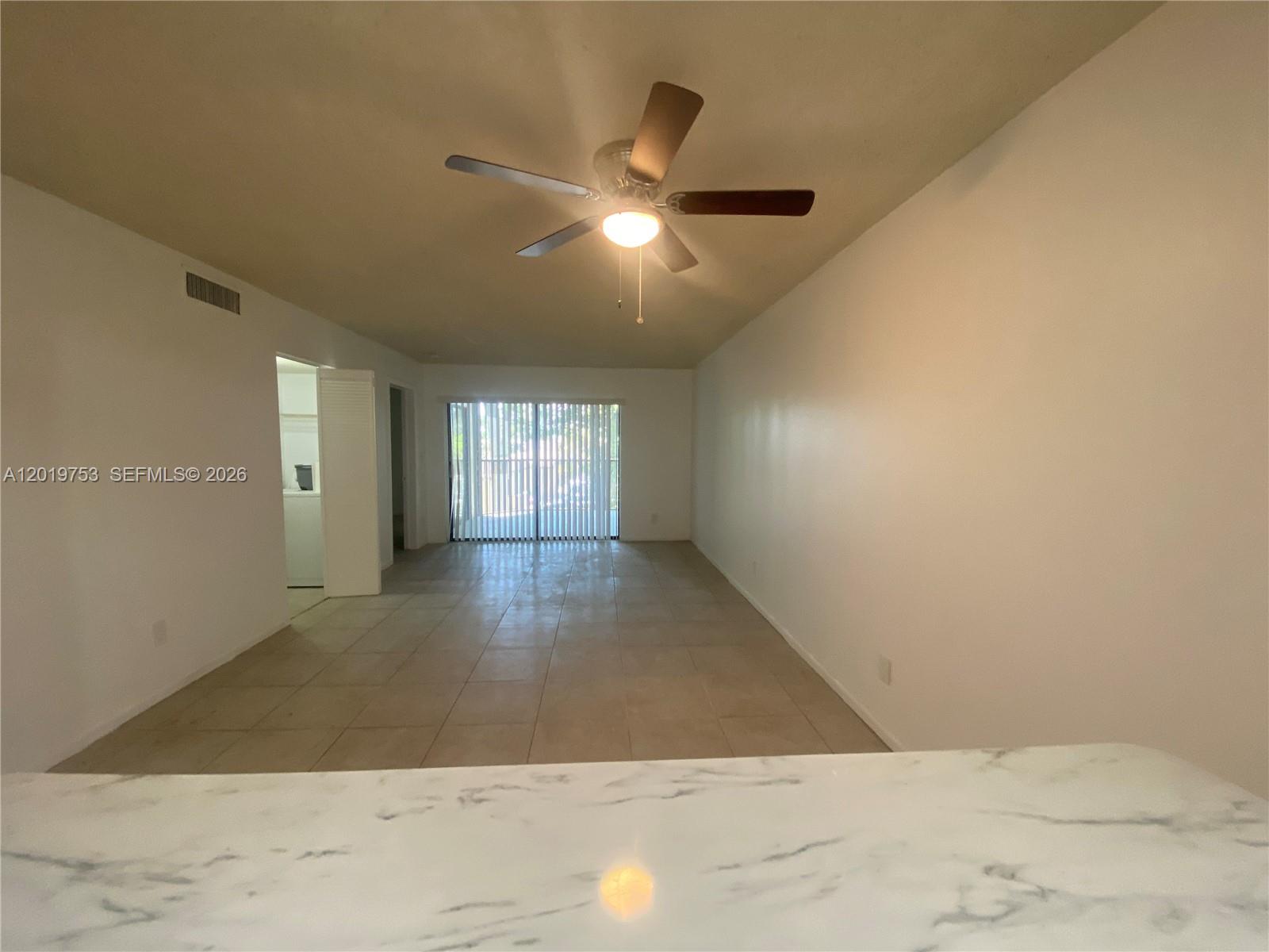 3410 Foxcroft Road, Unit 206 Miramar, FL 33025 - Photo 3 of 23 a view of an empty room and window
