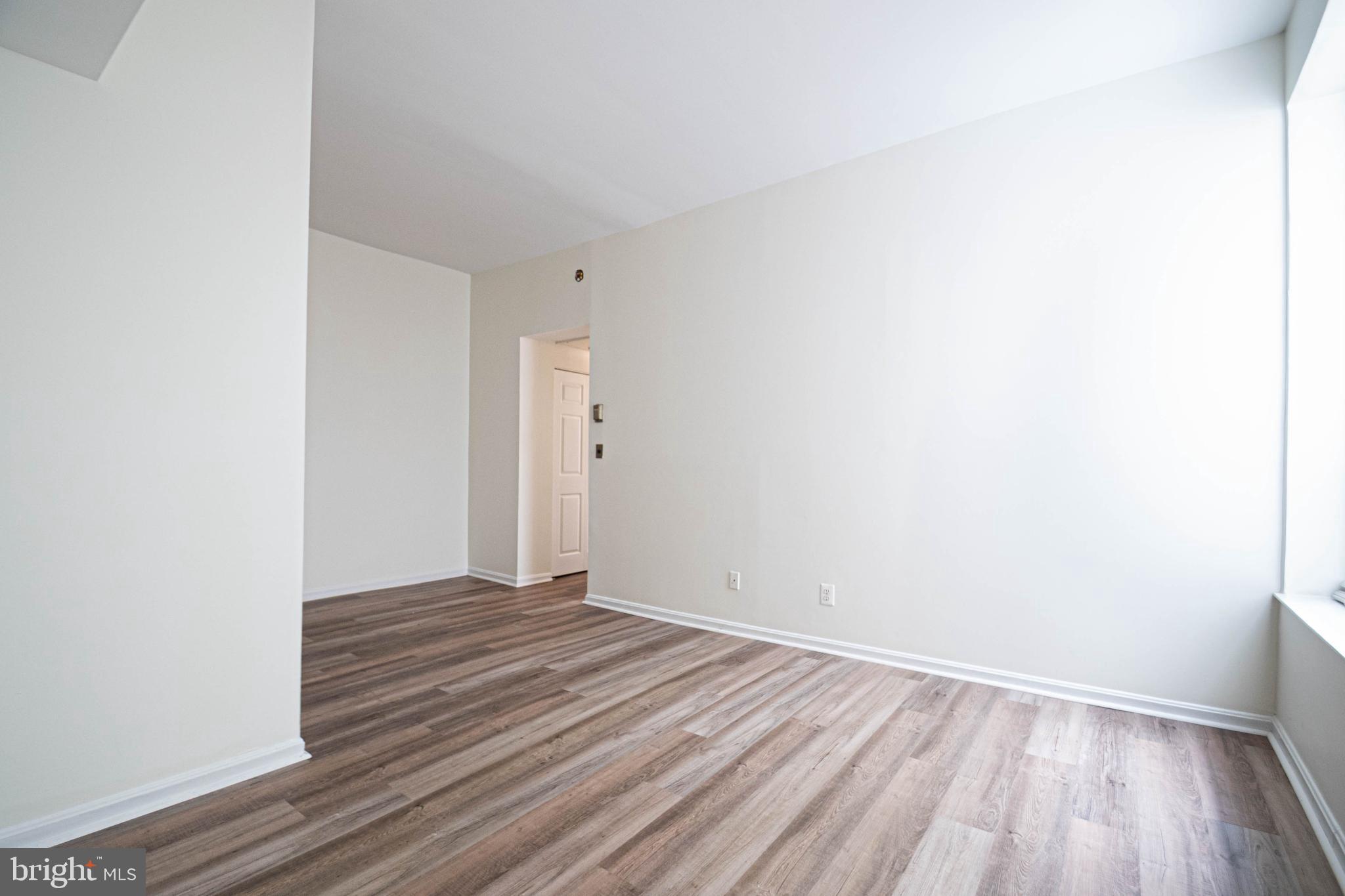 1669 Columbia Road Northwest, Unit 109 Washington, DC 20009 - Photo 15 of 35 a view of a room with wooden floor
