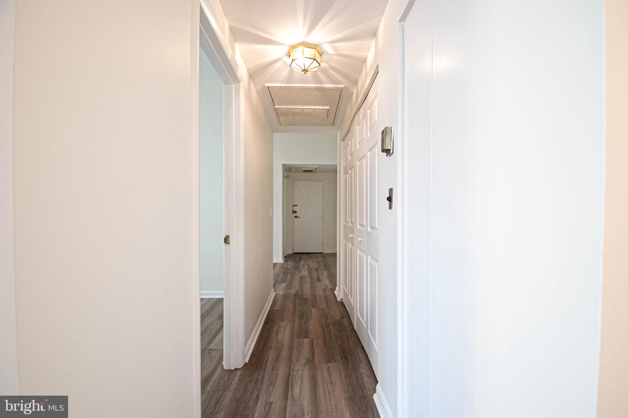 1669 Columbia Road Northwest, Unit 109 Washington, DC 20009 - Photo 20 of 35 a view of a hallway with wooden floor
