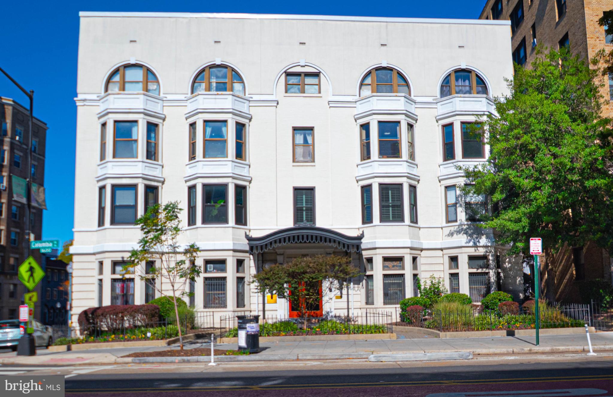 1669 Columbia Road Northwest, Unit 109 Washington, DC 20009 - Photo 2 of 35 a front view of residential houses with street