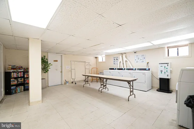 a view of a livingroom with furniture and white walls