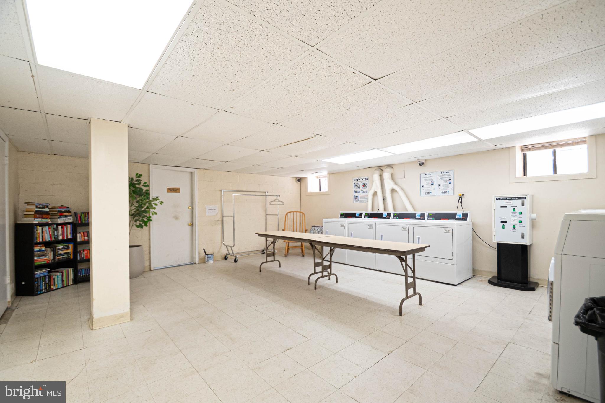 1669 Columbia Road Northwest, Unit 109 Washington, DC 20009 - Photo 34 of 35 a view of a livingroom with furniture and white walls