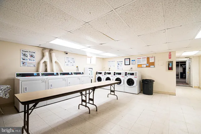 a room with lots of furniture and white walls