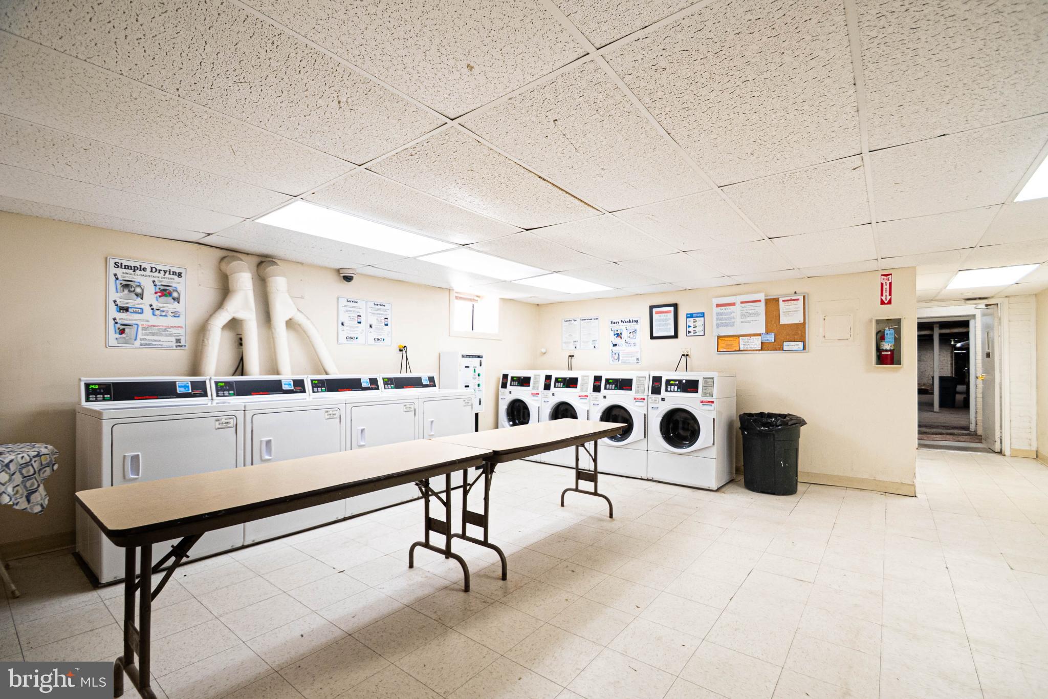 1669 Columbia Road Northwest, Unit 109 Washington, DC 20009 - Photo 35 of 35 a room with lots of furniture and white walls