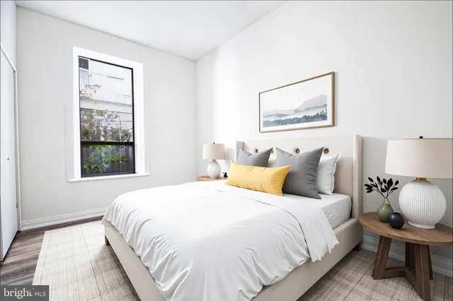 a bedroom with bed and window