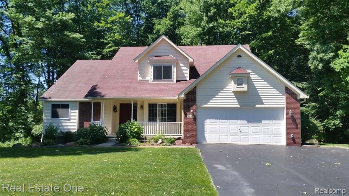 7933 Dubuque Road Clarkston, MI 48348 - Photo 1 of 26 Welcome to your new home nestled in the trees!