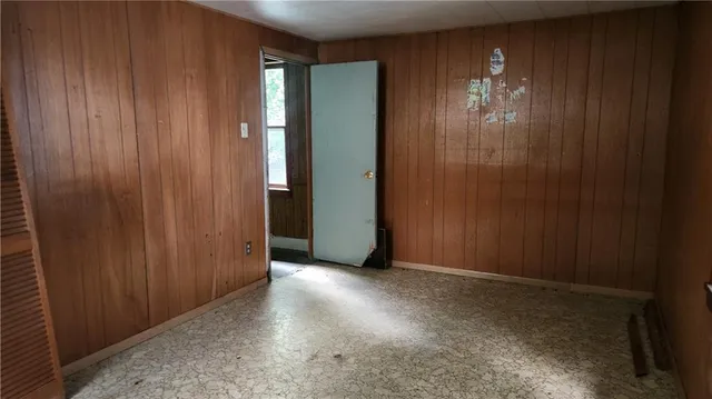a view of an empty room with closet area