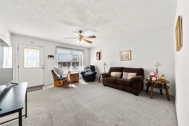 a kitchen with stainless steel appliances granite countertop a refrigerator sink and cabinets