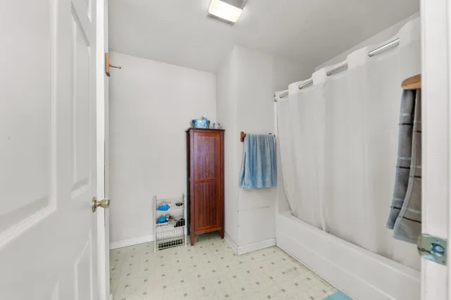 a bedroom with bed and window