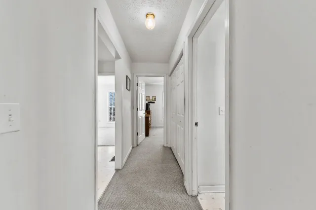a bathroom with a sink toilet and mirror