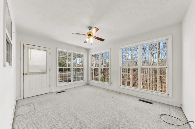 a view of porch with a bench