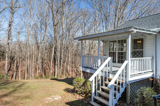 a view of a house with a snow in the yard