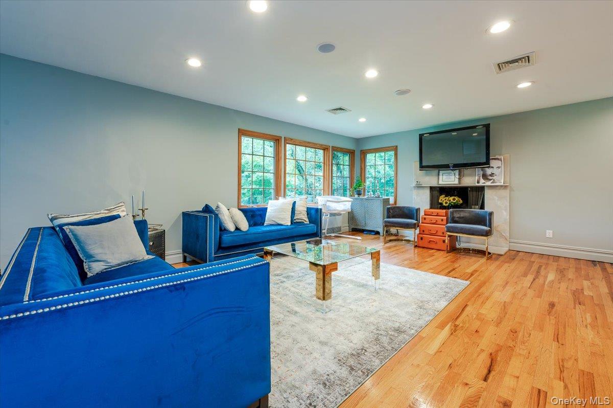 26 Redbrook Road Great Neck, NY 11024 - Photo 13 of 19 a living room with furniture and a flat screen tv