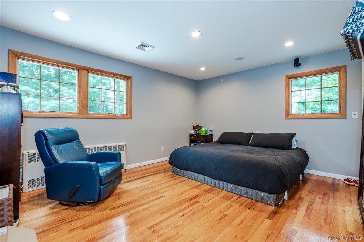 26 Redbrook Road Great Neck, NY 11024 - Photo 15 of 19 a room with a bed and a chair
