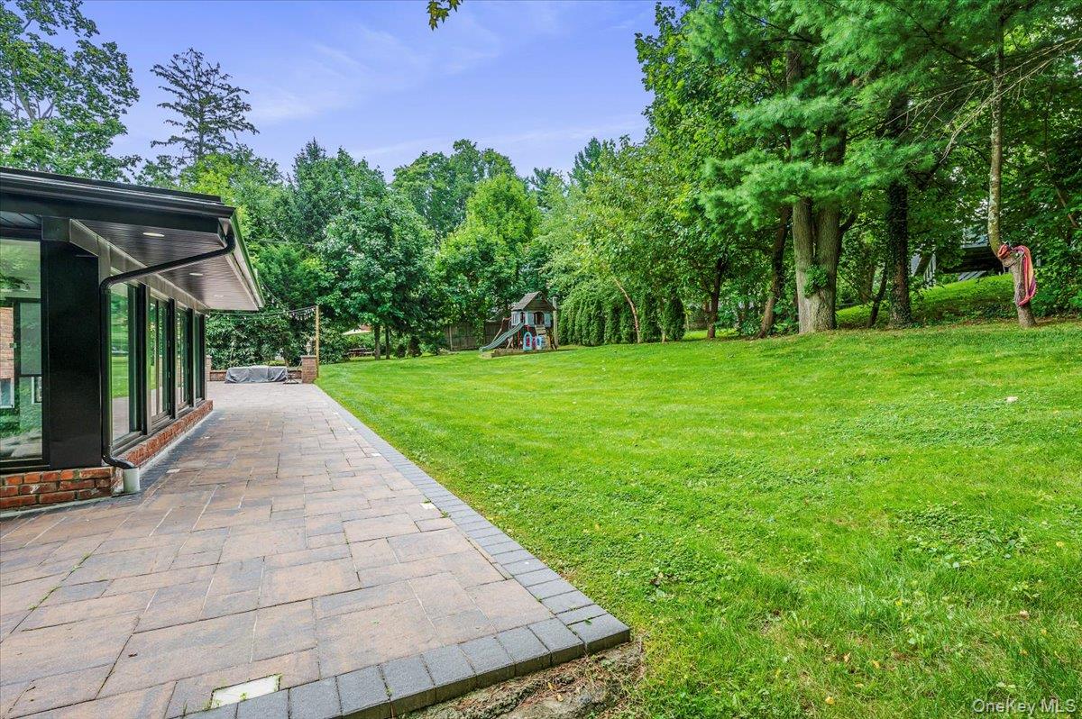 26 Redbrook Road Great Neck, NY 11024 - Photo 17 of 19 a view of a backyard with a garden and entertaining space