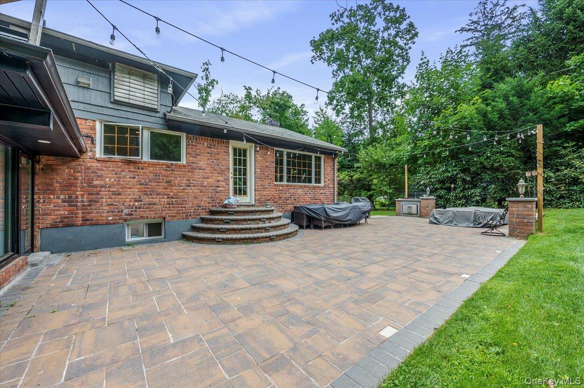 26 Redbrook Road Great Neck, NY 11024 - Photo 19 of 19 a view of a house with backyard and sitting area