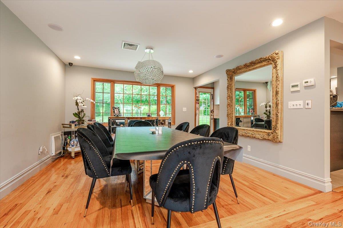 26 Redbrook Road Great Neck, NY 11024 - Photo 5 of 19 a view of a dining room with furniture window and wooden floor