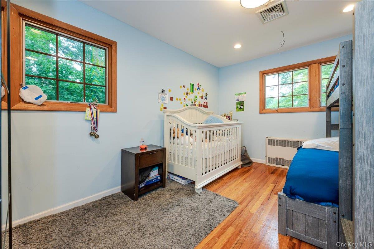 26 Redbrook Road Great Neck, NY 11024 - Photo 10 of 19 a bedroom with a bed and a window