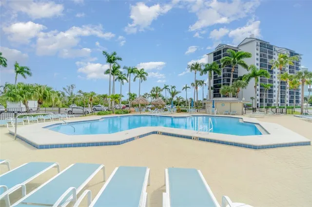 a view of a swimming pool with a patio
