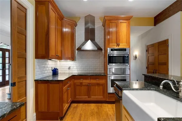 a bathroom with a sink a toilet and a shower