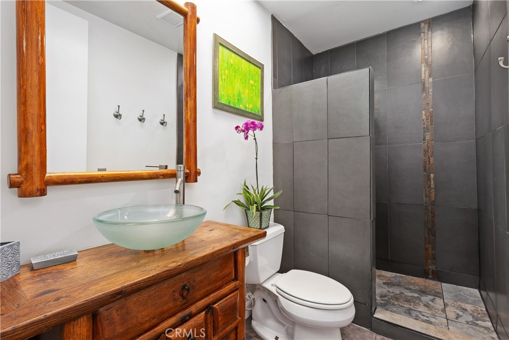 341 S Meadows Manhattan Beach, CA 90266 - Photo 16 of 50 a bathroom with a granite countertop sink a toilet and shower