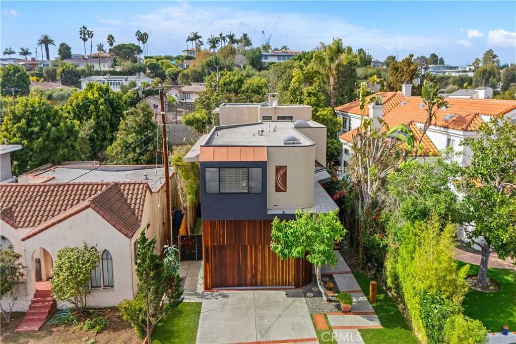 341 S Meadows Manhattan Beach, CA 90266 - Photo 2 of 50 an aerial view of a house with a yard potted plants and large tree