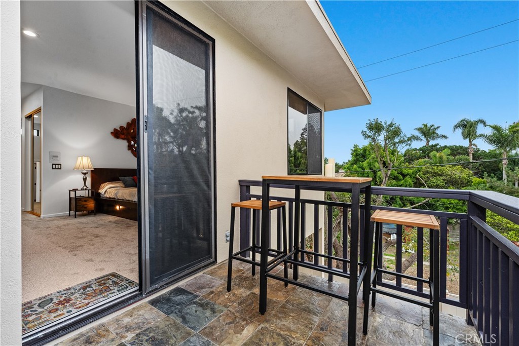 341 S Meadows Manhattan Beach, CA 90266 - Photo 23 of 50 a view of a porch with a table and chairs