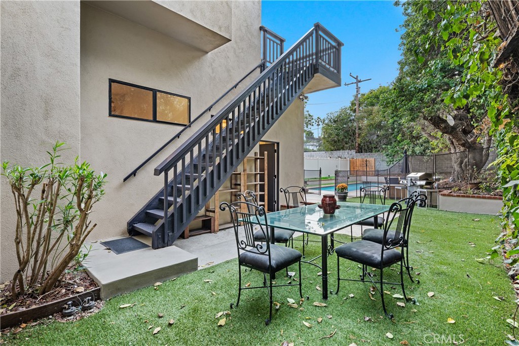 341 S Meadows Manhattan Beach, CA 90266 - Photo 24 of 50 a view of a chairs and table in backyard of the house