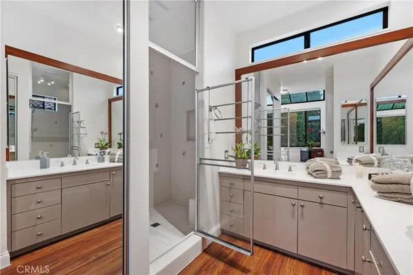 a white bath tub sitting next to a white sink