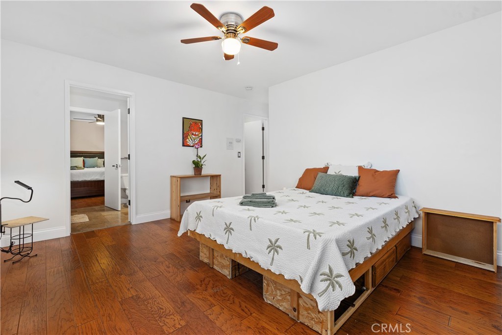 341 S Meadows Manhattan Beach, CA 90266 - Photo 35 of 50 a spacious bedroom with a bed and wooden floor