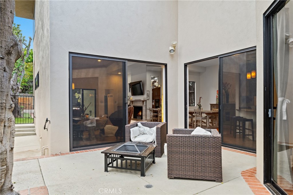 341 S Meadows Manhattan Beach, CA 90266 - Photo 40 of 50 a living room filled with furniture and a glass door