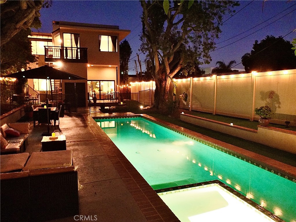 341 S Meadows Manhattan Beach, CA 90266 - Photo 43 of 50 a backyard of a house with table and chairs