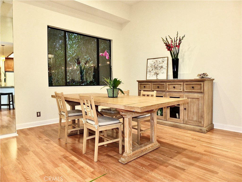 341 S Meadows Manhattan Beach, CA 90266 - Photo 46 of 50 a view of a dining room with furniture wooden floor and a rug