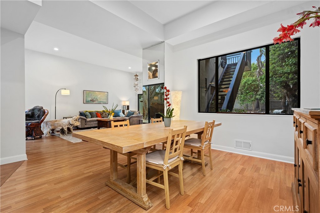 341 S Meadows Manhattan Beach, CA 90266 - Photo 10 of 50 a view of a dining room with furniture large windows and wooden floor