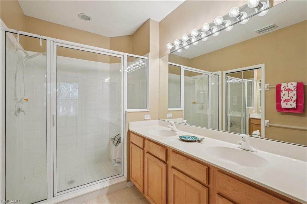 9583 Hemingway Lane, Unit 4309 Fort Myers, FL 33913 - Photo 10 of 18 a bathroom with a sink and a mirror