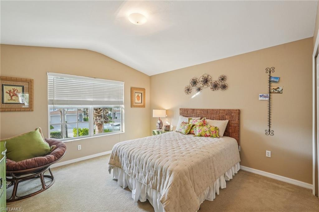 9583 Hemingway Lane, Unit 4309 Fort Myers, FL 33913 - Photo 11 of 18 a bedroom with a large bed and a window