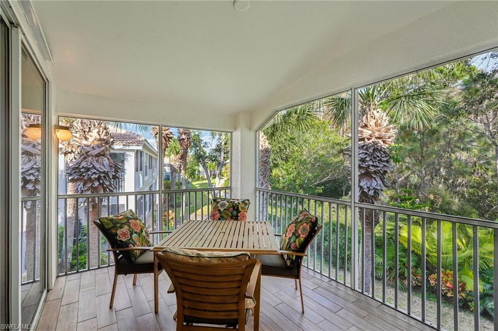 9583 Hemingway Lane, Unit 4309 Fort Myers, FL 33913 - Photo 13 of 18 a view of a city from a balcony with furniture