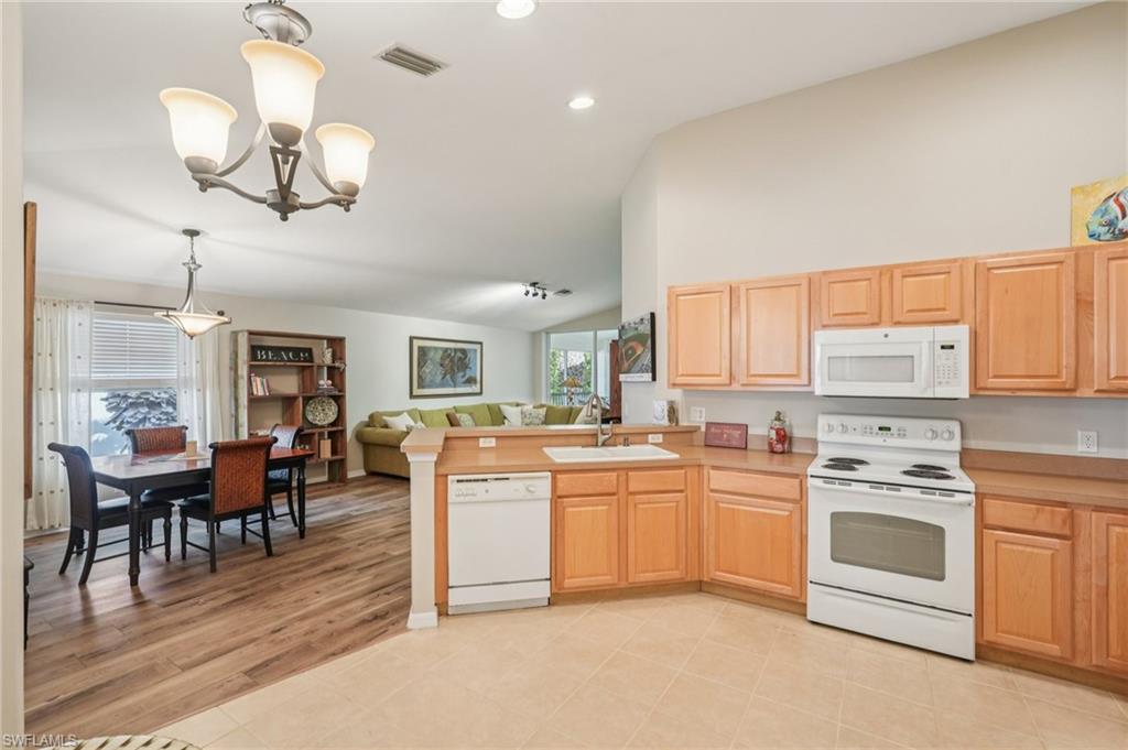9583 Hemingway Lane, Unit 4309 Fort Myers, FL 33913 - Photo 17 of 18 a kitchen with cabinets a sink and appliances