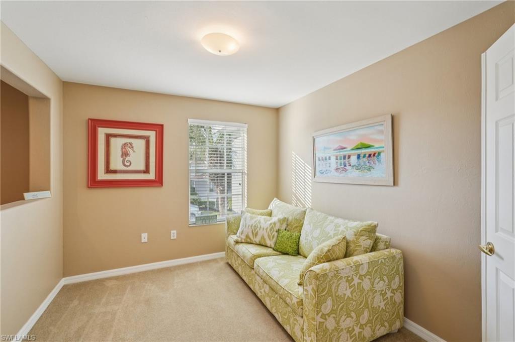 9583 Hemingway Lane, Unit 4309 Fort Myers, FL 33913 - Photo 7 of 18 a living room with furniture and a large window