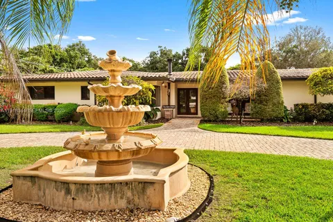 a view of a house with a swimming pool