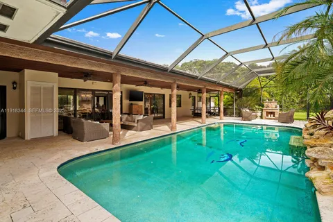 a view of a swimming pool with a patio
