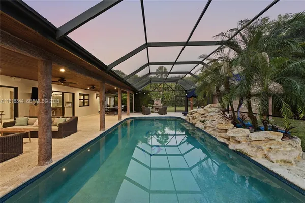 a view of a swimming pool with a patio
