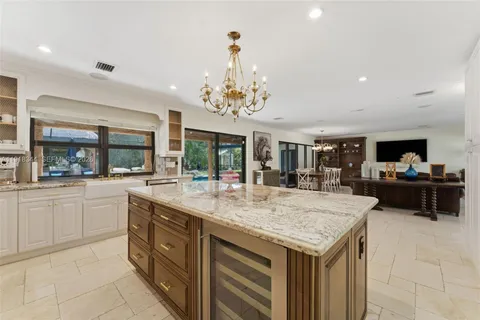 a kitchen with sink and center island