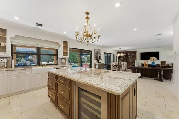 a kitchen with sink and center island