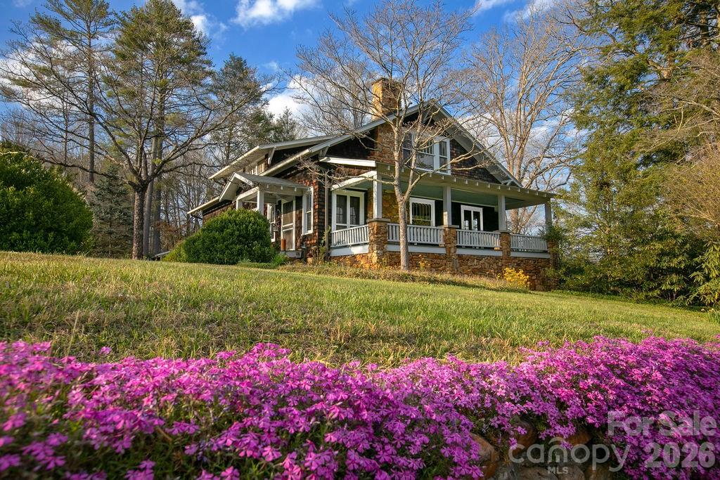 431 East Main Street Brevard, NC 28712 - Photo 2 of 45 a view of a house with a big yard and potted plants