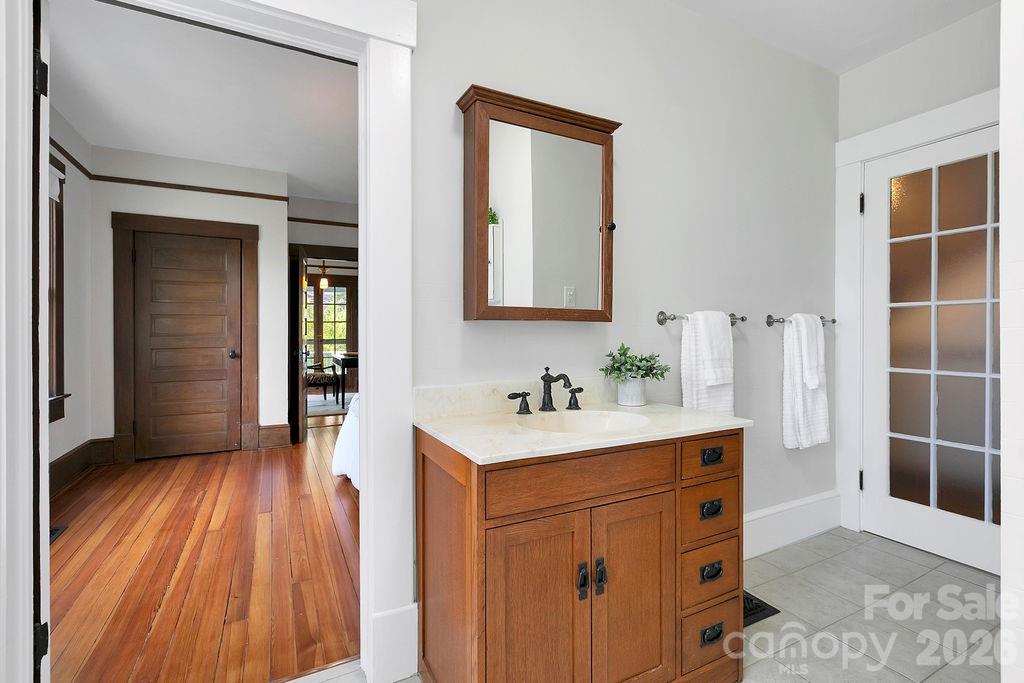 431 East Main Street Brevard, NC 28712 - Photo 22 of 45 a hallway view with wooden floor and cabinet