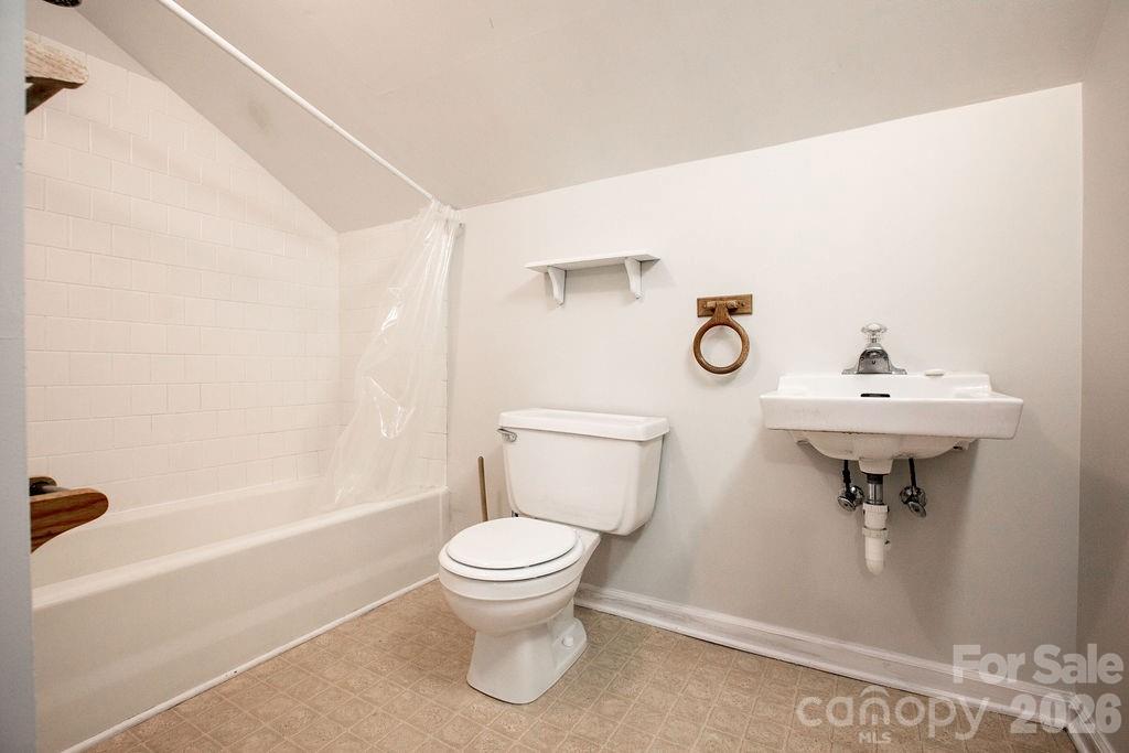 431 East Main Street Brevard, NC 28712 - Photo 32 of 45 a bathroom with a sink toilet and a mirror