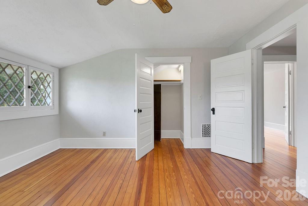 431 East Main Street Brevard, NC 28712 - Photo 37 of 45 an empty room with wooden floor and windows