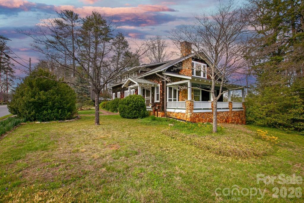 431 East Main Street Brevard, NC 28712 - Photo 42 of 45 a white house that has a tree in front of it